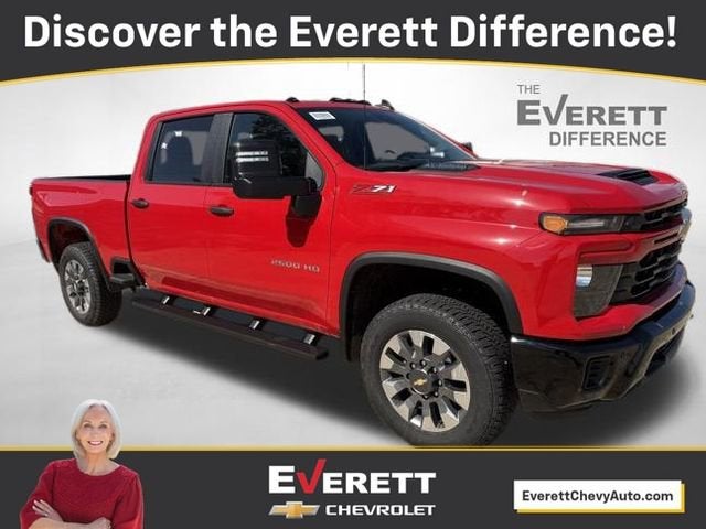 2026 Chevrolet Silverado 2500 HD Custom in Red Hot — front three-quarter view
