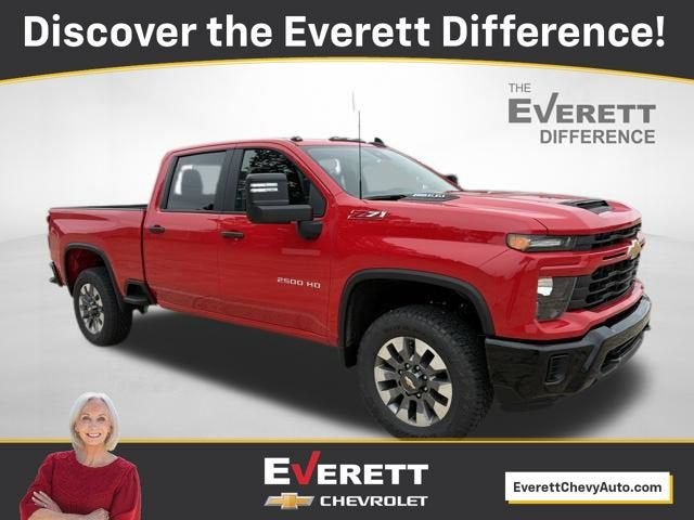 2026 Chevrolet Silverado 2500 HD Custom in Red Hot — front three-quarter view