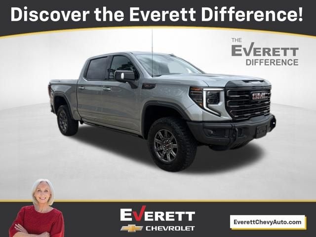 2024 GMC Sierra 1500 AT4X in Sterling Metallic — front three-quarter view